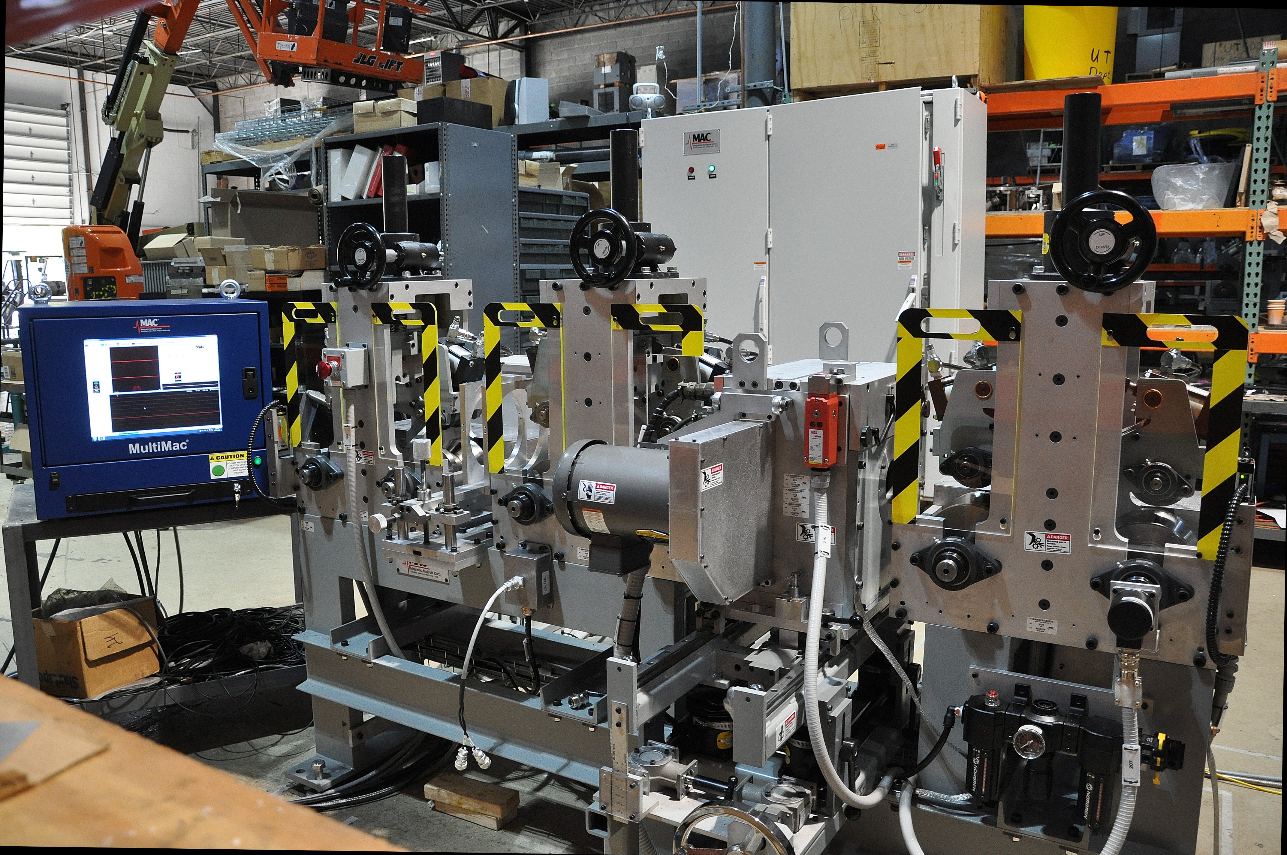 A NDT system by MAC, eddy current manufacturers, utilizing a MultiMac EC electronic, and an eddy current encircling coil and eddy current probe. 