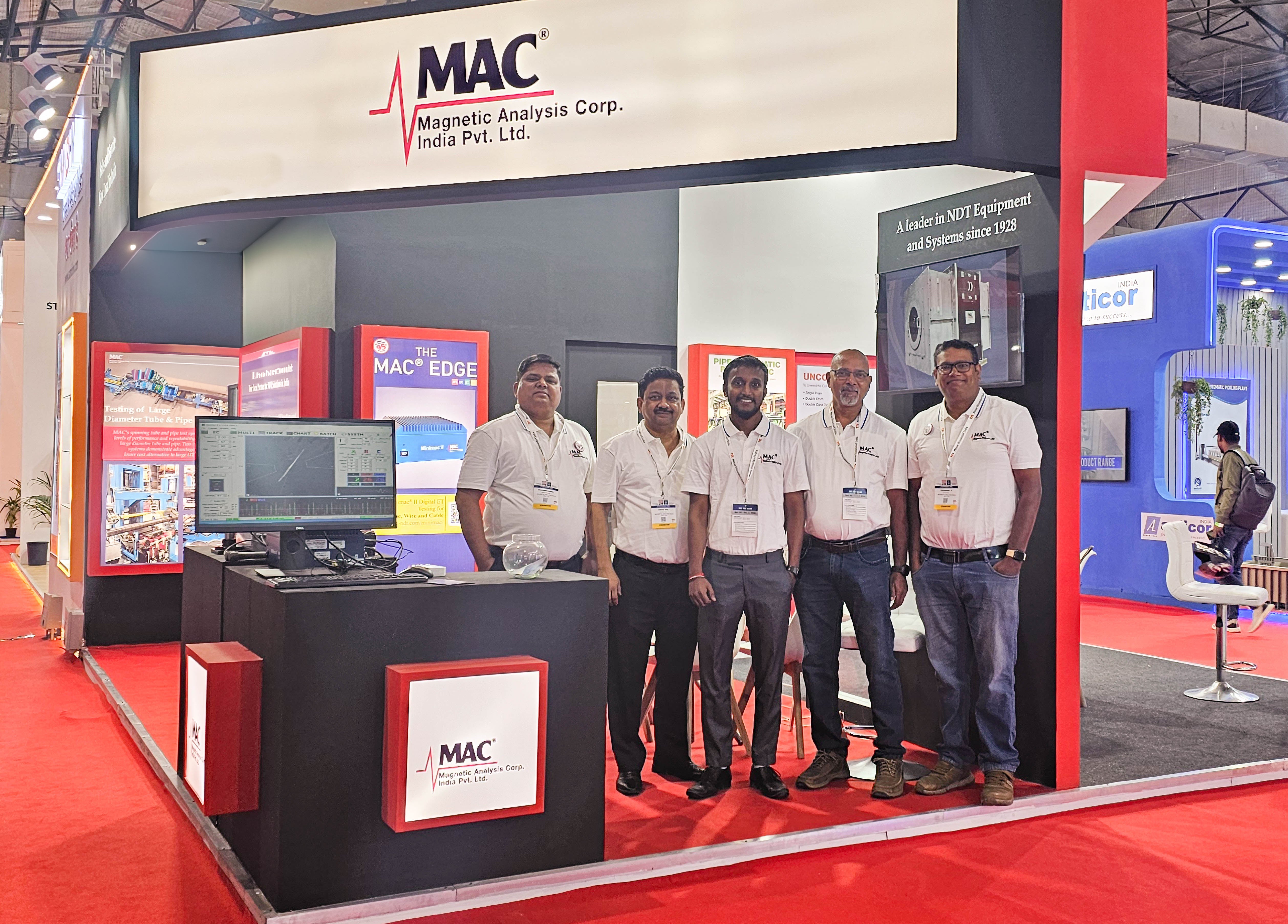 The Magnetic Analysis India Private Limited (MAIPL) team, part of MAC's global subsidiaries,  standing in front of the Tube 2024 booth in Mumbai offering a full product portfolio of ECT, UT, PAUT, and MFL equipment and systems to the Indian audience. 